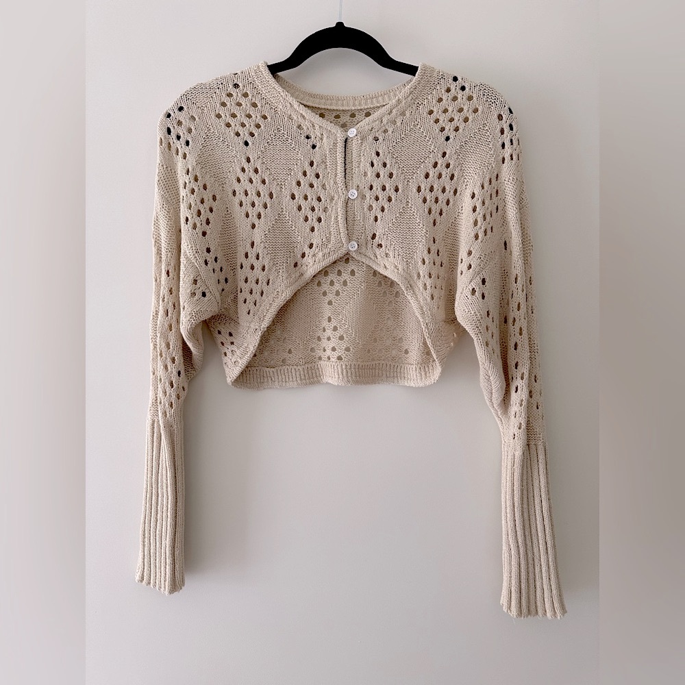 Beige Cropped Argyle Pointelle Knit cardigan.